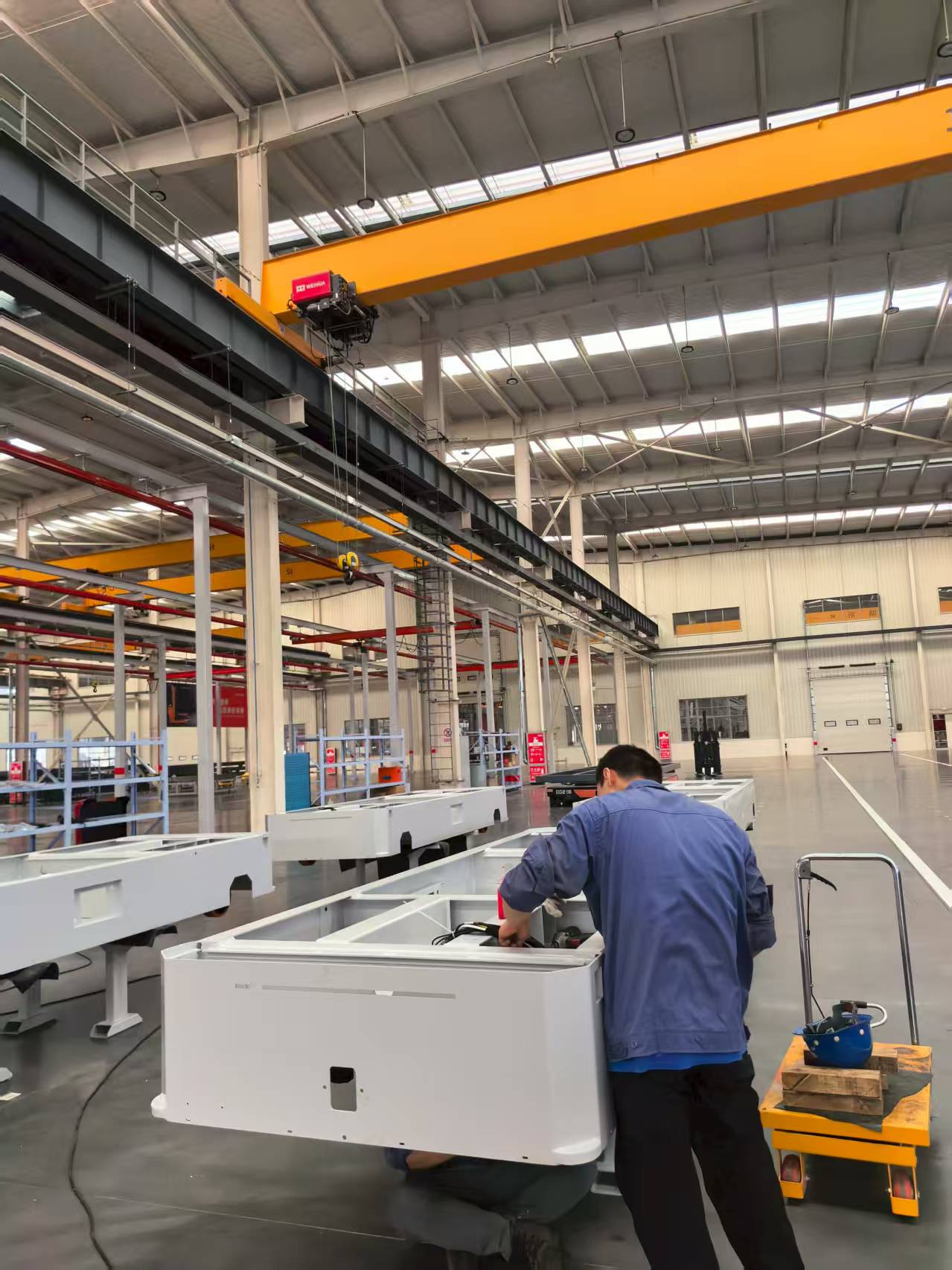 Technician assembling electric transfer equipment